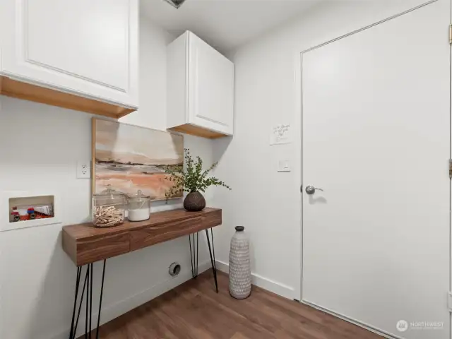 Laundry room that leads to 3-car garage.