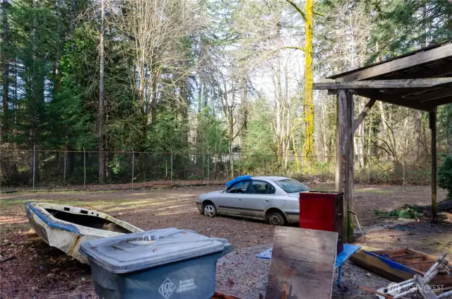 Fully fenced area behind shop