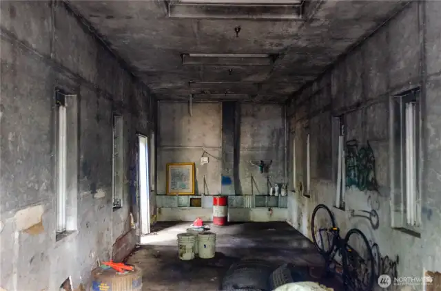 Inside back area of shop, this shop has a ventilation system and a large storage tank for fire protection