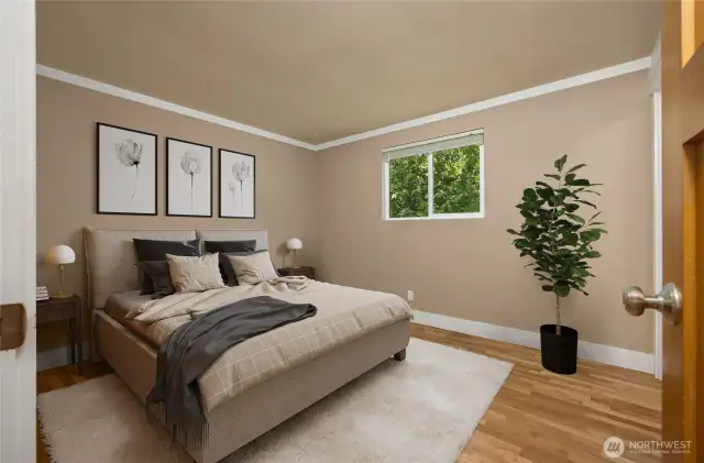 Virtually staged primary bedroom - hardwood floors and 3/4 bath