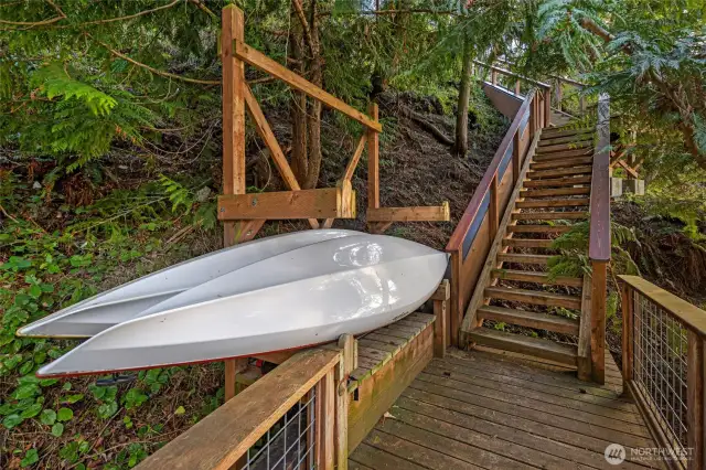 Lighted stairs with kayak racks.