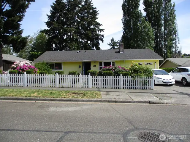 Welcome home! Mature landscaping and white picket fence!