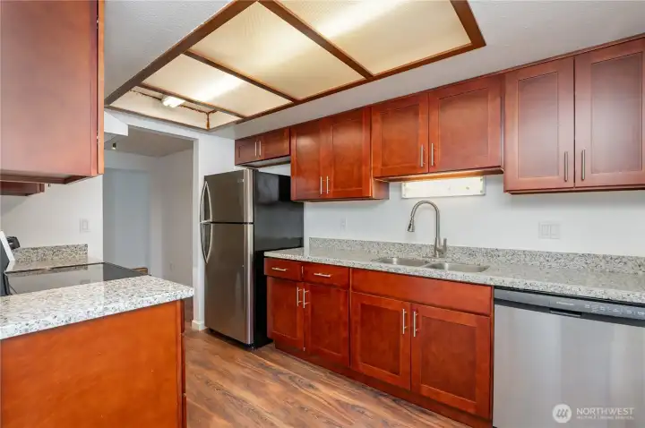 Kitchen offers abundant cabinet and counter space, ideal for cooking and storage.