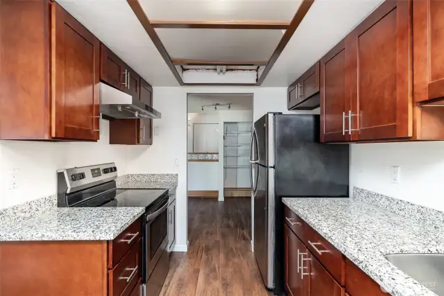Kitchen offers abundant cabinet and counter space, ideal for cooking and storage.