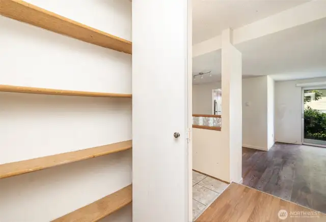 Hallway features a convenient storage closet, perfect for keeping essentials organized and out of sight.