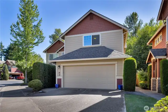 Two car garage with 2 parking spaces in the driveway