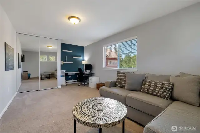 Huge 2nd bedroom with floating shelves and large windows