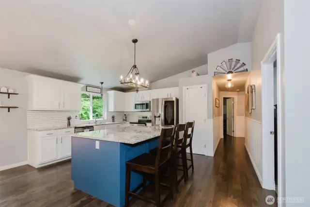 Oversized, custom island in kitchen, SS appliances, pantry, new granite countertops & tile backsplash. InstaView fridge included.