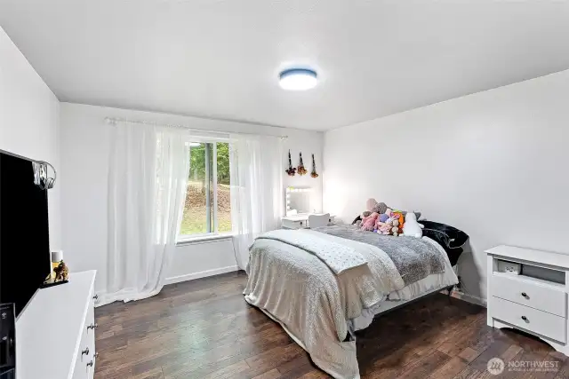 Fourth bedroom, again with large window to take in the views and the new flooring that's throughout the home.