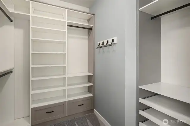 primary closet has closet organizer