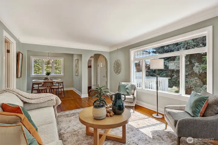 Living room looking to front door. Notice the beautiful arch mirrors the door shape.