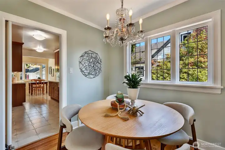 Abundant windows throughout provide a bright, natural light experience, as seen in this dining area.