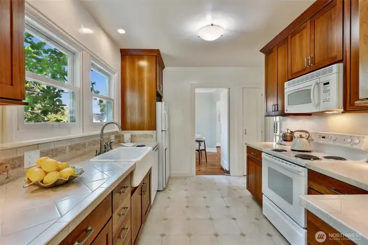 Kitchen toward dining area. Double pane windows bring in ample light.