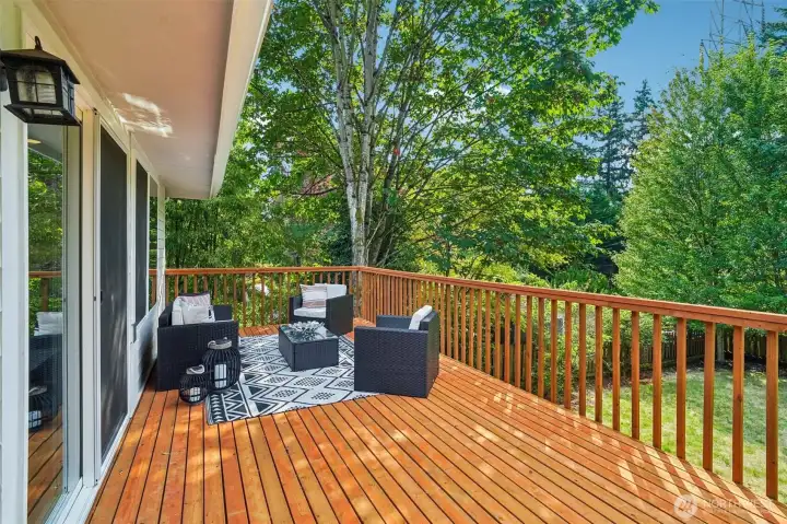 The back deck is perfectly spacious, soaks up great sunlight, and offers perfect indoor/outdoor flow for summer BBQs and relaxation.