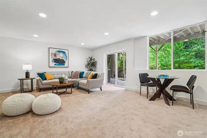 This spacious, bright and airy rec room is ready for movie and game nights!