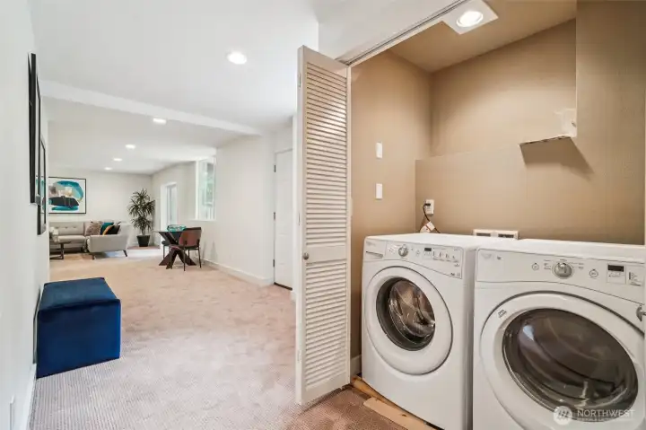 Laundry is located just off of the rec room on the lower level.