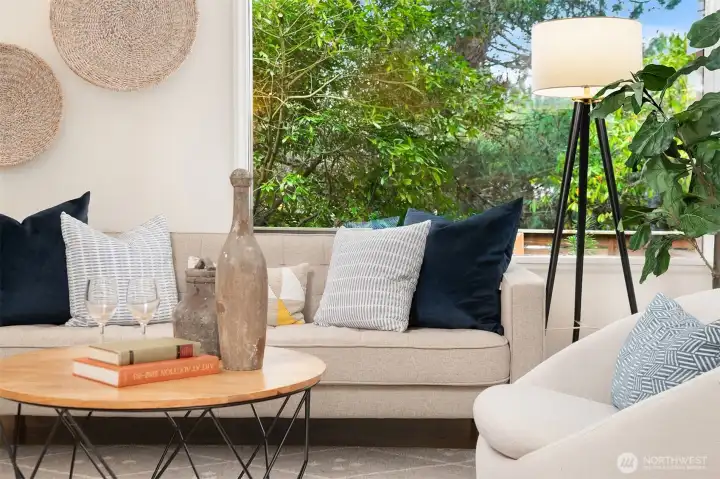 The trees and plantings outside are beautiful in the living room, but don't stop the light from coming in.