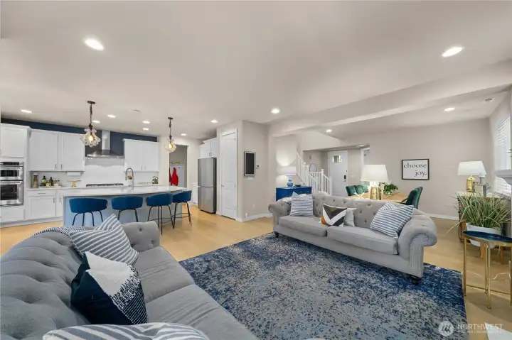 On the main floor, the great room concept is the heart of this home, with large windows filling the space with natural light. Relax in front of the cozy living area fireplace, or host your guests at the adjacent formal dining space.