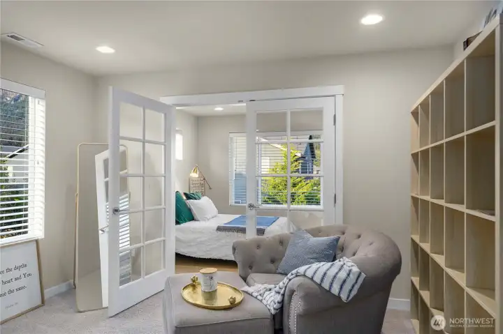 Upstairs, the expansive primary awaits, offering a large walk-in closet with organization and a lovely en suite bath with dual vanities, walk-in shower and soaking tub. Another bedroom connected through French doors could also be a nursery or large sitting room.