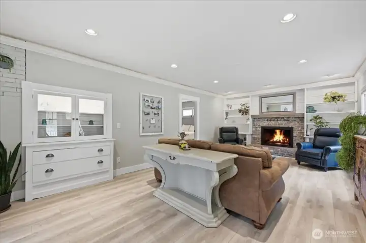 Built in cabinetry and shelves honor the 1926 styling. New luxury vinyl plank is practical and easy to care for.