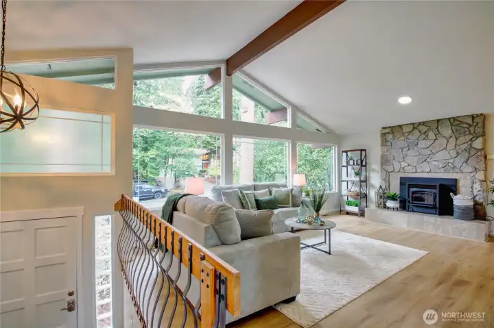 Large picture windows saturate the home with natural light