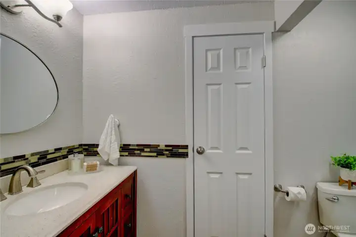 This shows half the primary ensuite with door to linen closet