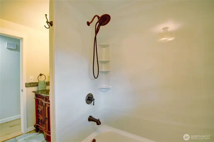 Upstairs main full guest bath with new shower surround