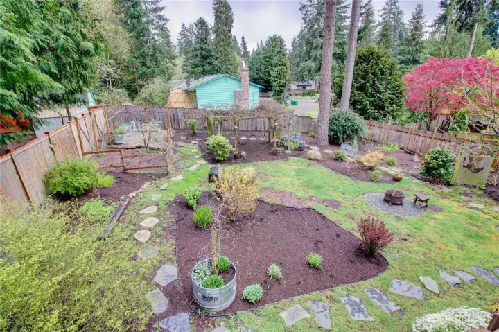 Beautiful landscaping with large garden beds and mature fruit trees, a gardener's delight!