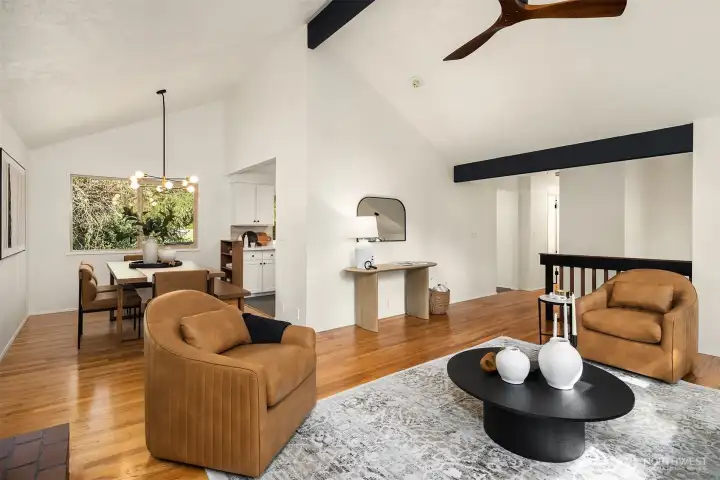 The details, such as the wood beams & custom stair railing complete this space beautifully.