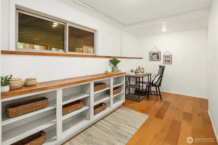 Downstairs study or hobby corner with built-in storage.