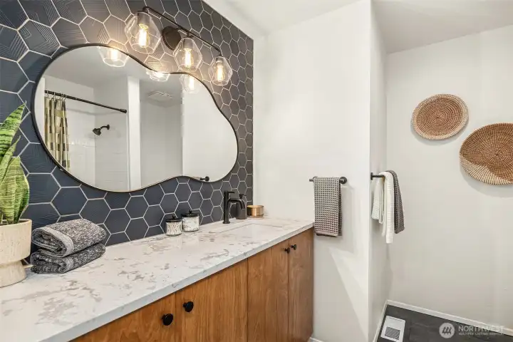 Upstairs NEWLY remodeled bathroom with tub . . . fun & chic.