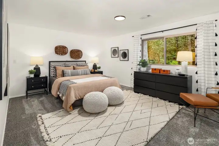 Downstairs bedroom (non-conforming) with huge windows with pretty peeks of green!