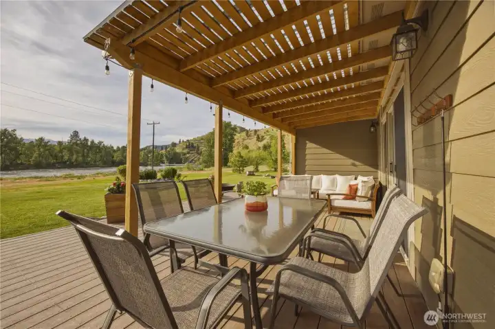 Imagine relaxing on this deck while listening to the river