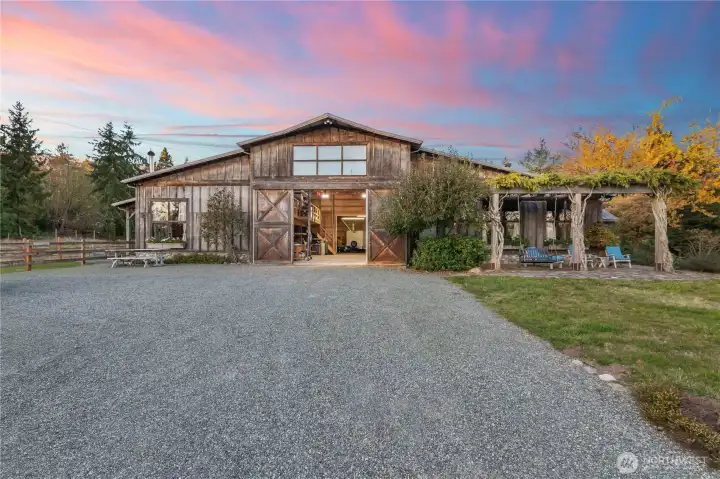 5000 square foot barn includes walk in stalls, elevated hay storage, tack room.