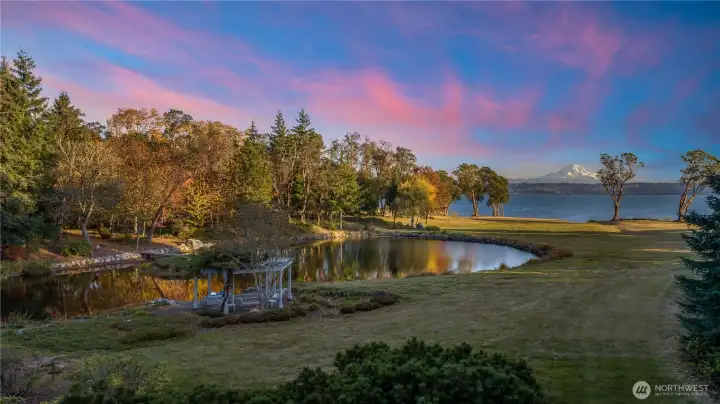 Natural pond with island,  dock and gazebo