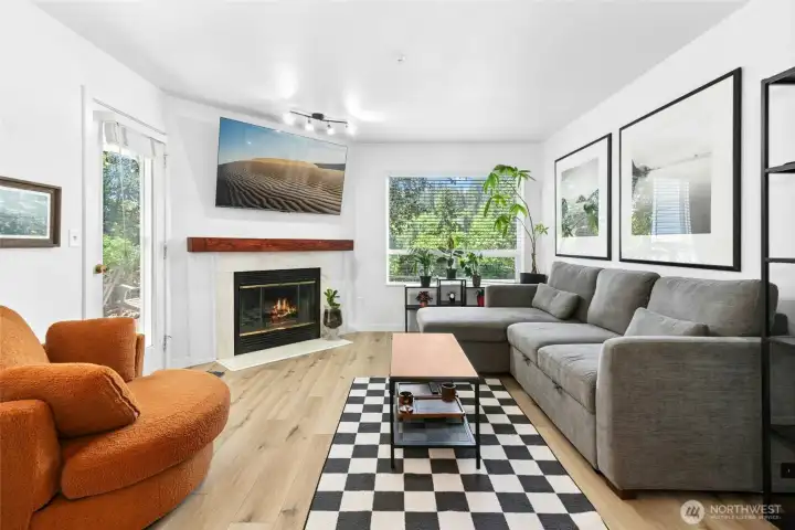nature setting surrounds to add privacy to the living room with fireplace walk out to patio