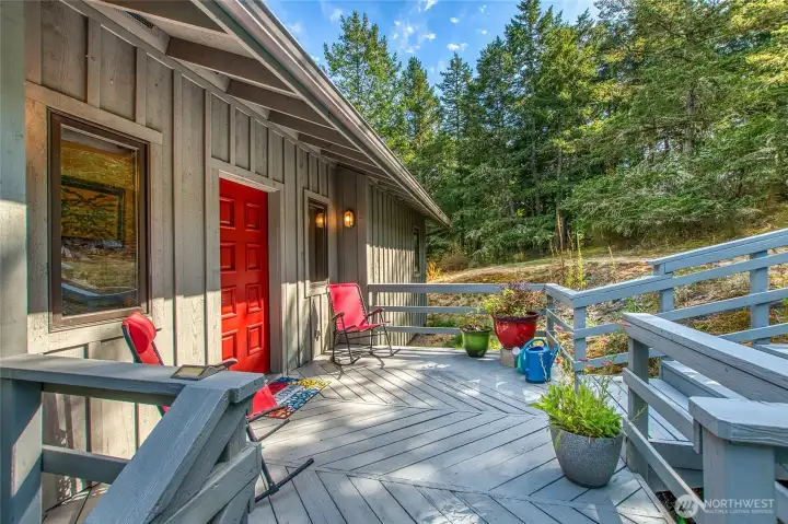 West facade includes the main entrance to the home with a generous size deck West facade includes the main entrance to the home with a generous size deck