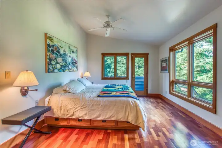main floor primary suite with views to the water and door to private balcony. main floor primary suite with views to the water and door to private balcony.