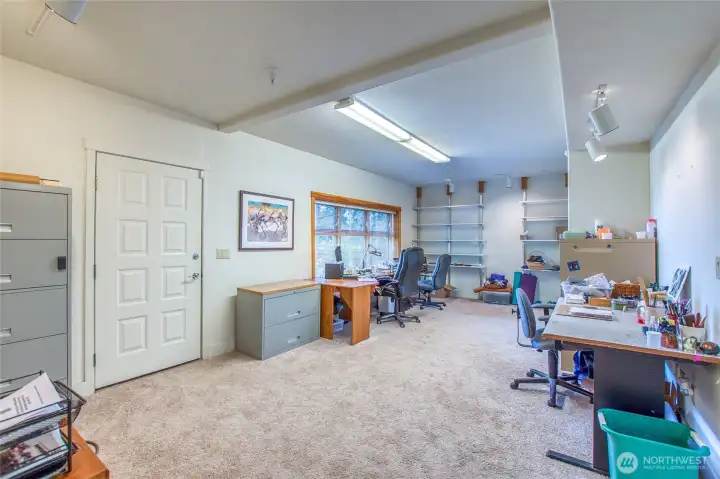 Lower level flex space has window with waterview and an exterior entry. Current owners use this as office/project space but it could also serve as a 4th bedroom Lower level flex space has window with waterview and an exterior entry. Current owners use this as office/project space but it could also serve as a 4th bedroom