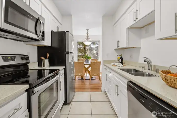 Kitchen with stainless steel appliances. Kitchen with stainless steel appliances.