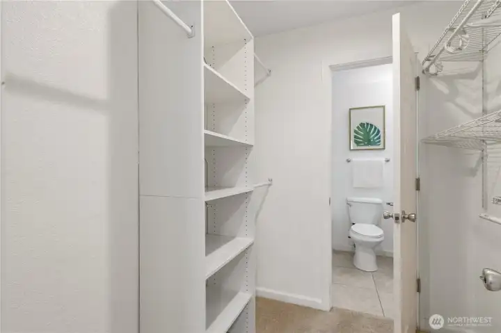 Walk-in closet with built-in shelves. Walk-in closet with built-in shelves.