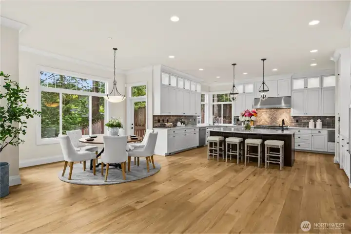 Inviting breakfast nook with serene backyard views and seamless patio access.