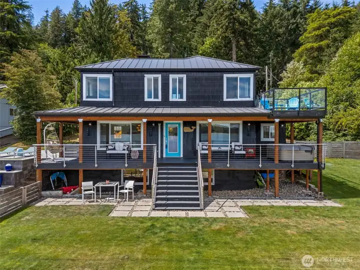 New wrap around deck with Trex decking, cable railing and stair access.