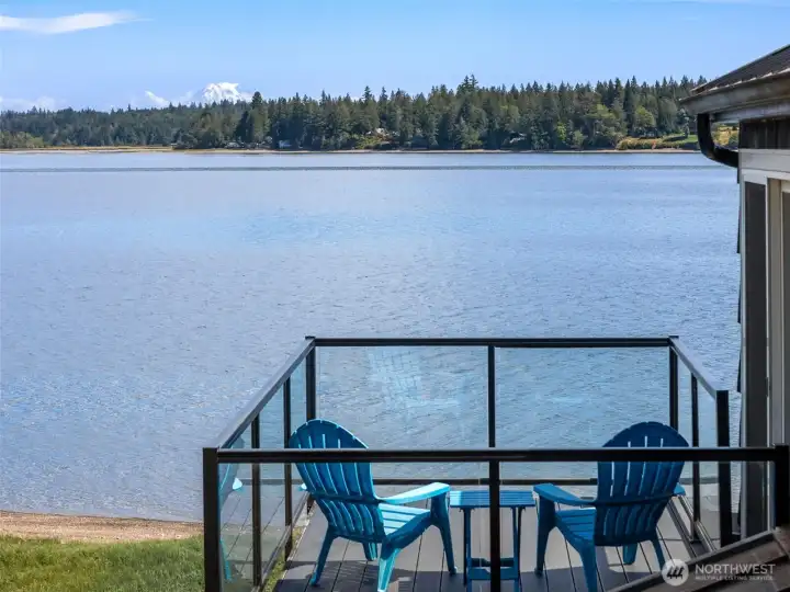 Enjoy peaceful times admiring the waterfront view and Mt. Rainier on your private deck off from the primary bedroom.