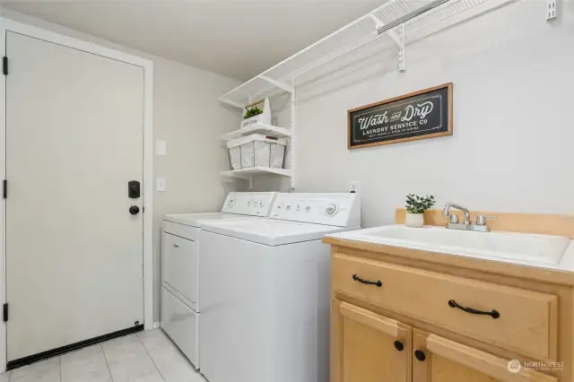 Utility room, located between the garage and the kitchen.