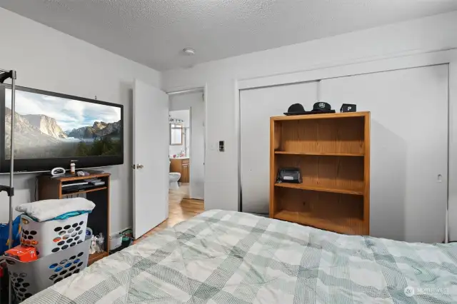 Another view of the second bedroom showing the double door closet.