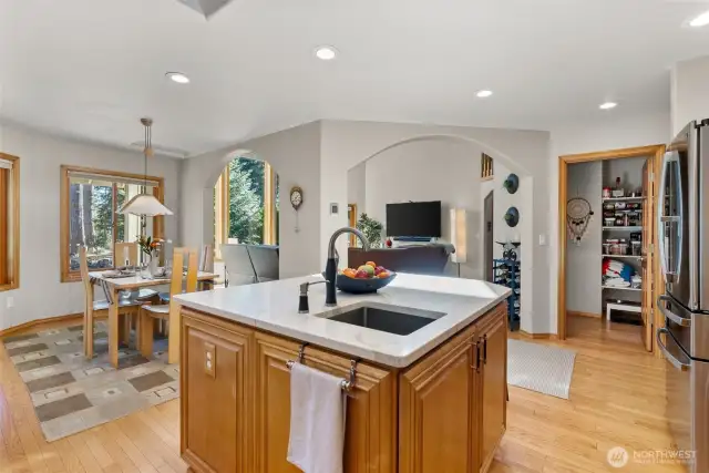 View looking out to the great room, kitchen eating area and pantry.