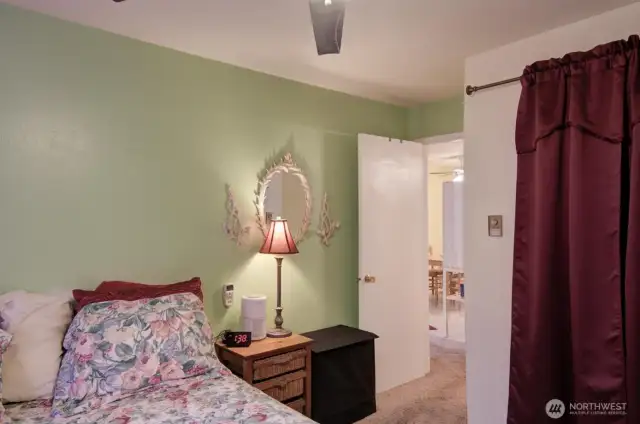 Bedroom leading out to living room, kitchen & bathroom