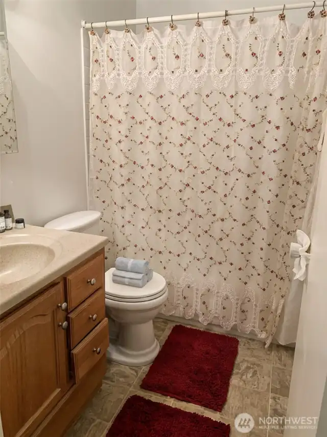Bathroom with bath & shower