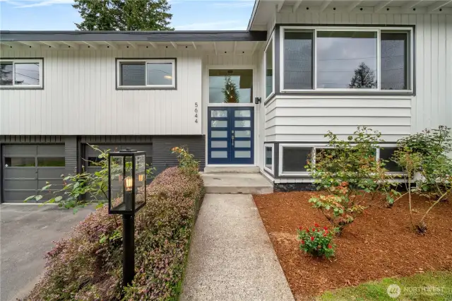 Stunning mid century curb appeal with fresh exterior paint and new front door.